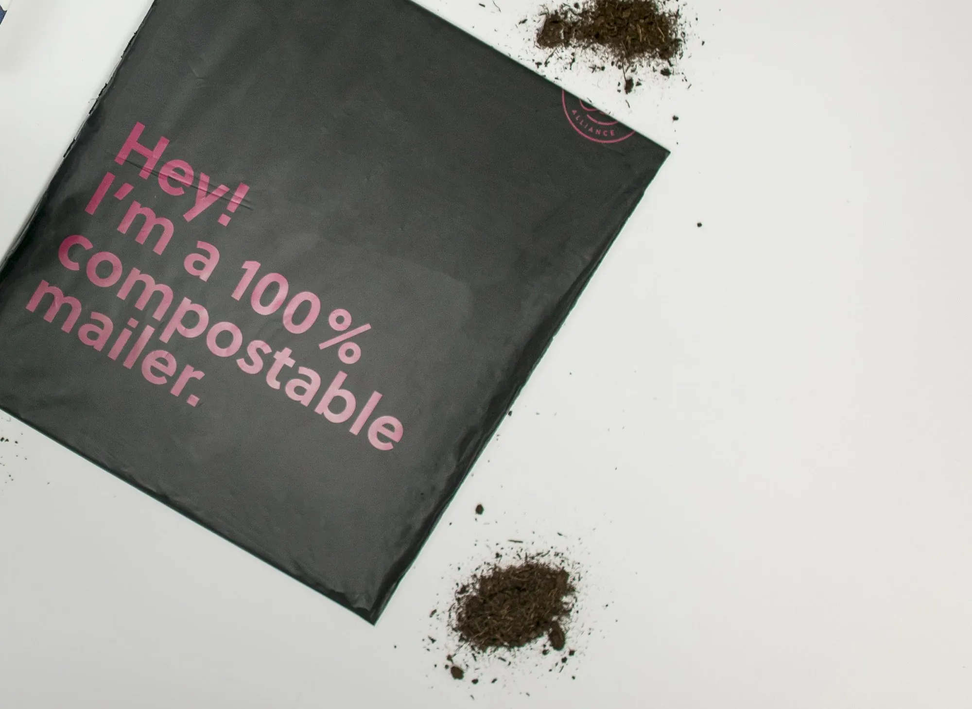 The black WAAS mailer reading: Hey! I am a 100% compostable mailer